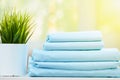 Closeup stack of blue clean bedding on blurred background Royalty Free Stock Photo