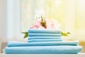 Closeup stack of blue clean bedding on the table. Blurred background Royalty Free Stock Photo