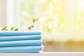 Closeup stack of blue clean bedding on the table. Blurred background. Copy space Royalty Free Stock Photo