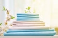 Closeup stack of blue and white clean bedding on the table. Blurred background Royalty Free Stock Photo