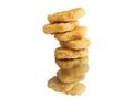 Closeup of a stack of chicken nuggets on a reflective white surface