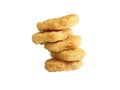 Closeup of a stack of chicken nuggets on a reflective white surface