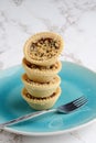 Closeup stack of fruit crumble tarts with a fork Royalty Free Stock Photo