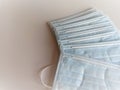 Closeup stack of light blue surgical disposable masks. Royalty Free Stock Photo