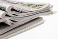 Closeup of stack of newspapers. Assortment of folded newspapers isolated on white. Breaking news, journalism, power of the media, Royalty Free Stock Photo