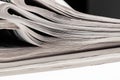 Closeup of stack of newspapers. Assortment of folded newspapers isolated on white. Breaking news, journalism, power of the media, Royalty Free Stock Photo