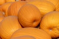 Closeup of a stack of orange pumpkins on a pumpkin farm during Halloween