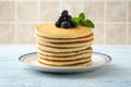 Closeup stack of pancakes with blueberries and mint