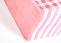 Closeup of a stack of red checked or checkered paper napkins isolated Royalty Free Stock Photo