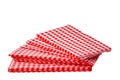 Closeup of a stack of red checked or checkered paper napkins isolated on a white background. Clipping path. Macro. Stacked towel Royalty Free Stock Photo