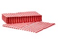 Closeup of a stack of red checked or checkered paper napkins isolated on a white background. Clipping path. Macro. Stacked towel Royalty Free Stock Photo