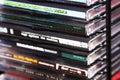 Closeup of stacked CD's with various titles