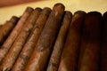 Closeup on stacked hand-rolled cigars Royalty Free Stock Photo