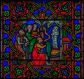 Closeup of a stained glass window in the Notre Dame de Paris Cathedral in Paris France