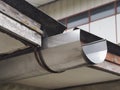 Stainless steel gutter under roof Royalty Free Stock Photo