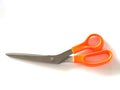 Stainless steel Scissors handle is made of plastic orange color Royalty Free Stock Photo