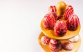 Closeup stand for eggs with Easter red eggs with folk white pattern and which stand on white background. Top view. Ukrainian tradi