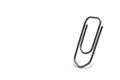 closeup standing office paper clip white background Royalty Free Stock Photo