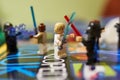 Closeup of Star Wars lego figures combat.