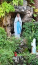 Statue of Our lady of grace virgin Mary view with natural background in the rock cave at Thailand. selective focus. Royalty Free Stock Photo