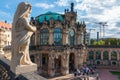 Closeup of a statue on the parapet of baroque Zwinger palatial complex in Dresden