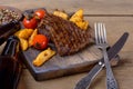 Closeup steak with beer and vegetables