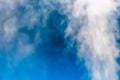 closeup steam from the air humidifier on blue background. health, disease prevention