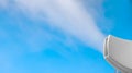 closeup steam from the air humidifier on blue background. health, disease prevention