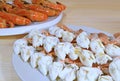 Closeup Steamed Flower Crab Legs with Blurry Flame Grilled River Prawns Served on Wooden Table