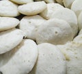 Closeup of steamed rice pancakes in a plate isolated from black vignettes, food photography, Indian cuisine, rice meals