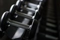 Closeup steel dumbbell in fitness gym