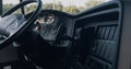 Closeup steering wheel dashboard in driver cabin. Safety transport interior.