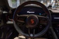 closeup steering wheel, Interior, cockpit of Porsche Taycan Turbo S battery-electric sports Car, sedan Porsche Automobil Holding, Royalty Free Stock Photo