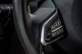 Closeup of steering wheel with media function buttons. Royalty Free Stock Photo