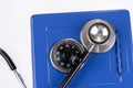 Closeup stethoscope and closed blue safe