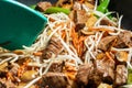 Closeup of Stir-fry in a skillet being mixed with a spatula. Royalty Free Stock Photo