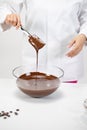 Closeup stirring and pouring milk melted chocolate isolated on white background Royalty Free Stock Photo