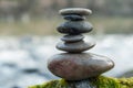 Stone balance on rock covered by moss in border river Royalty Free Stock Photo