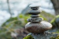 Stone balance on rock covered by moss in border river Royalty Free Stock Photo