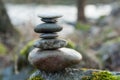 stone balance on rock covered by moss in border river Royalty Free Stock Photo