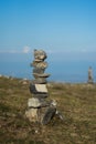 stone balance at the top of the mountain on blue sky background Royalty Free Stock Photo
