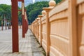 Closeup of a stone fence on a recreational trail in a park Royalty Free Stock Photo