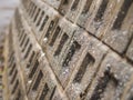 Closeup stone wall textured in shallow depth of field.