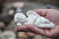 Stoned angel in hand of woman in cemetery