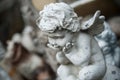 Stoned angel on tomb in cemetery