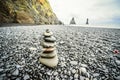 Closeup of the stones perfectly balanced on each other on the Reynisfjara beach in Iceland Royalty Free Stock Photo