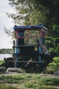 Closeup stranded old wooden boat on sandy beach background