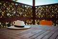 Closeup on straw hat on table in gazebo Royalty Free Stock Photo