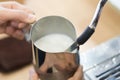 Closeup stream milk for make hot coffee latte art with machine, Royalty Free Stock Photo