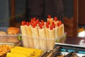 Closeup of street food market stall with french style hot dogs in a tray Royalty Free Stock Photo